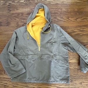A Japanese-made men’s reversible hoodie, mustard and khaki color, cotton.